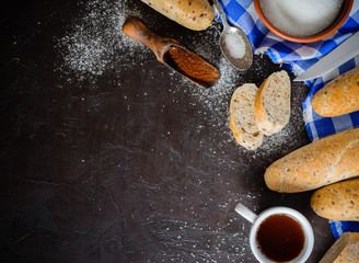 Obraz na płótnie Canvas Morning breakfast. Coffee with bread or buns. Sugar, spoon and blue napkin.
