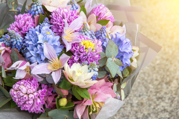 Beautiful elegant designer pink purple blue bouquet of florist with different flowers close-up. Floral background
