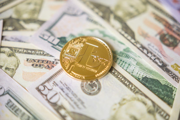 Lightcoin cryptocurrency coin on us dollars close up.