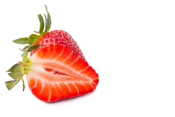 Juicy strawberries, one halved on white background