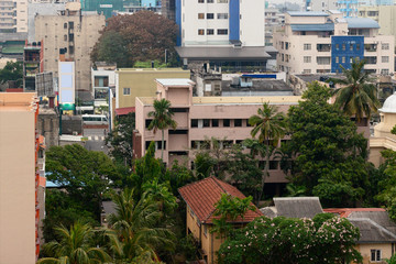 Aerial drone shoot above the architecture of Colombo, Sri Lanka. Modern and antuque houses. Ocean...
