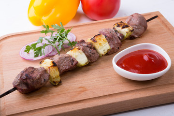 Grilled meat with zucchini on a skewer