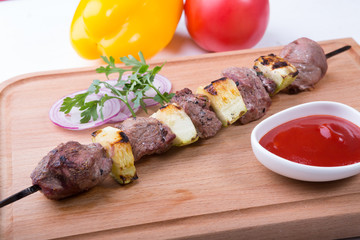 Grilled meat with zucchini on a skewer