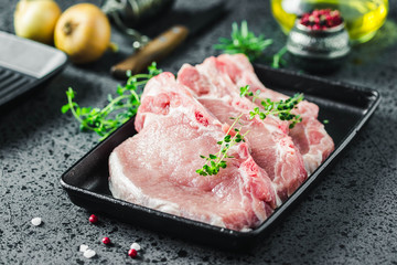 Fresh sliced meat on cast iron griddle. Selective focus, space for text.