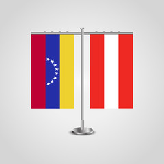 Table stand with flags of Venezuela and Austria. Two flag. Flag pole. Symbolizing the cooperation between the two countries. Table flags