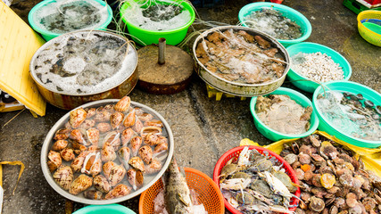 Assortament of fresh seafood. Different types of beautiful shells in the Phu Quoc market in Vietnam for seafood restaurant