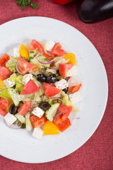 Mixed fresh greek salad on a plate