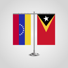 Table stand with flags of Venezuela and East Timor. Two flag. Flag pole. Symbolizing the cooperation between the two countries. Table flags