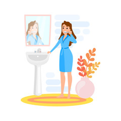 Woman brushing teeth using toothbrush and toothpaste