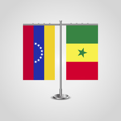 Table stand with flags of Venezuela and Senegal. Two flag. Flag pole. Symbolizing the cooperation between the two countries. Table flags