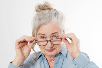 Surprised and shock Senior woman with wrinkle face and eye care glasses isolated on white background. Mature healthy lady. Copy space. Seniors lifestyle and old people happy concept.