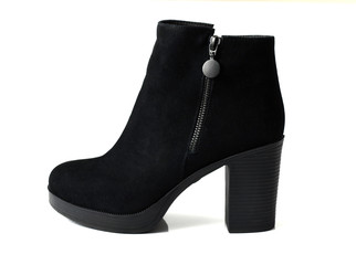 One Black womens ankle boots on a white background