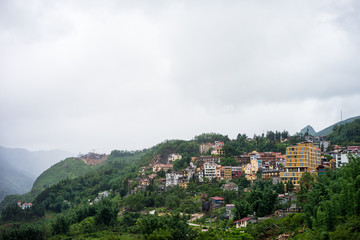 Fototapeta premium Landscape view of valley, village and paddy fields in Sapa