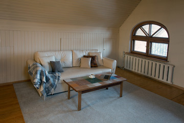 Leather sofa, table, laptop and cup of tea