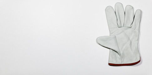 Obraz premium Pair of white glove on white wooden plank, DIY Concept.
