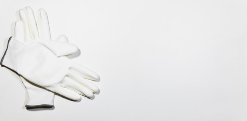 Pair of white glove on white wooden plank, DIY Concept.
