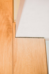 Closeup - compliance with the technology of laying laminate - compensation gap