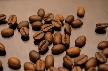 coffee beans close up on black glass