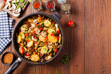 Fried pan vegetables, with mushrooms and dried tomatoes. Seasoned with a mix of herbs.