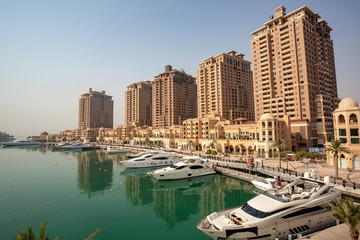 DOHA, QATAR – SEPTEMBER 06 2013: Mediterranean-style towers in Porto Arabia, The Pearl Qatar.