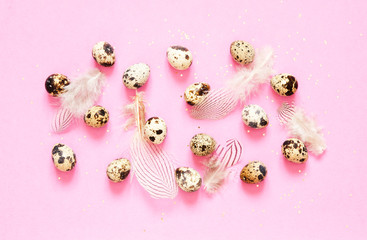  Pattern with quail eggs and  feathers on pink  background. Image