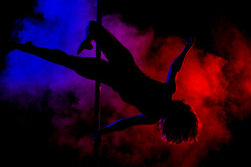 Obraz na płótnie Canvas pole dance girl silhouette with smoke