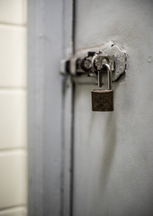 Door latch with an unlocked padlock