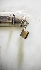 Door latch with an unlocked padlock