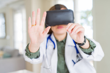 Doctor woman doing surgery simulation using virtual reality glasses