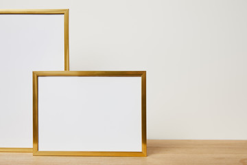 mock up frames on wooden table at home