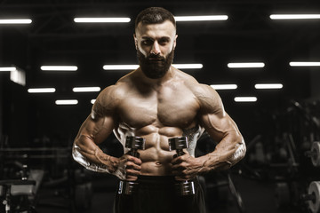 Fototapeta na wymiar Handsome strong athletic men pumping up muscles workout bodybuilding concept background