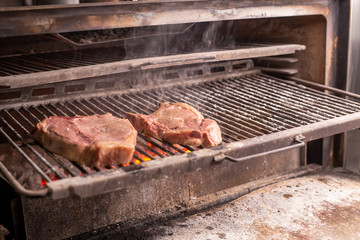 Food concept - Roasting a steak of horse meat