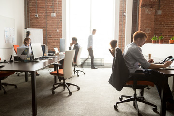 Busy staff employees group working on computers in office rush