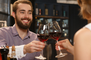 Little anniversary. Portrait of a young couple having a date at the restaurant drinking wine together