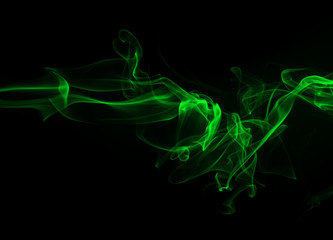 Fototapeta na wymiar Green smoke on black background and darkness concept