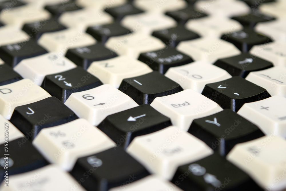 Fototapete set of keys from old computer keyboards laid out on the table