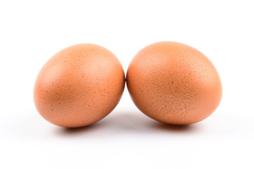 Brown chicken eggs on wooden table isolated on white background
