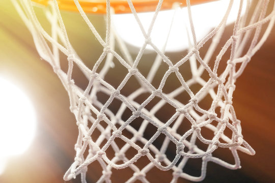 Close-up of mesh basketball hoop. Toned