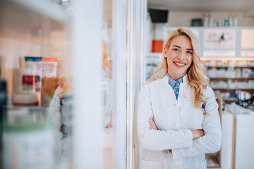 Portrait of a young smiling blonde pharmacist.