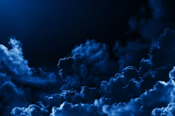 Fotobehang Mystical midnight sky with stars surrounded by dramatic clouds. Dark natural background with night starry cloudy sky. Moonlit clouds © valerybrozhinsky