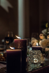 candles on the wedding table are burning