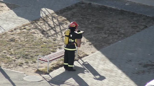 Fireman man puts on equipment and fire equipment before starting work, training, exercises, professional