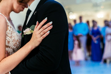 bride and groom dance, hand on shoulder, ring