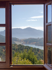 View from the window to the lake and mountains