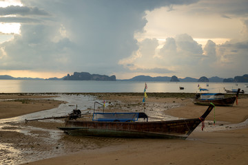 Fototapeta na wymiar Tropical beach, long tail boats,golden sunset, gulf of Thailand,Krabi,