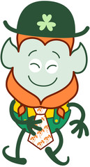 Saint Patrick's Day Leprechaun with red beard, pointy ears and folkloric hat and costume feeling proud while showing his beautiful tie decorated with clovers