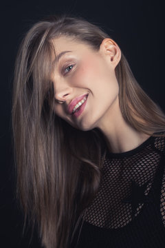 portrait of young woman. no makeup. model. black. smile