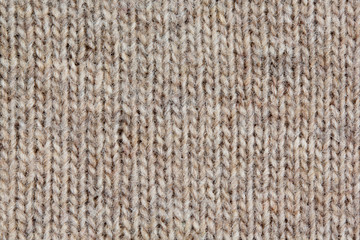 Knitted sweater, closeup neutral background