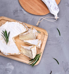 round piece of brie cheese and sausage