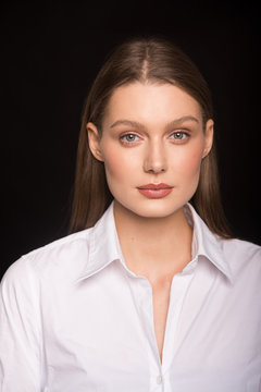 young girl.  beautiful girl.  office worker.  shirt.  light makeup. business